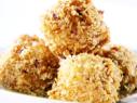 Ham and cheese croquettes are fried after rolled in panko bread crumbs.