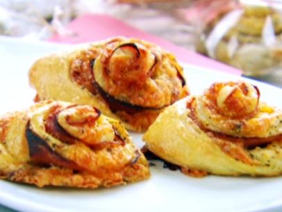 Ham and cheese spirals are made with refrigerated pizza dough, shredded cheddar, and sliced ham.