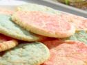 Lemon sugar cookies are topped with red and blue colored sugar.