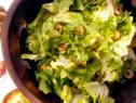  Escarole salad with anchovy dressing and chopped olives.
