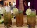 Gina's brown sugar mojito is served with fresh mint leaves and garnished with a slice of lime.