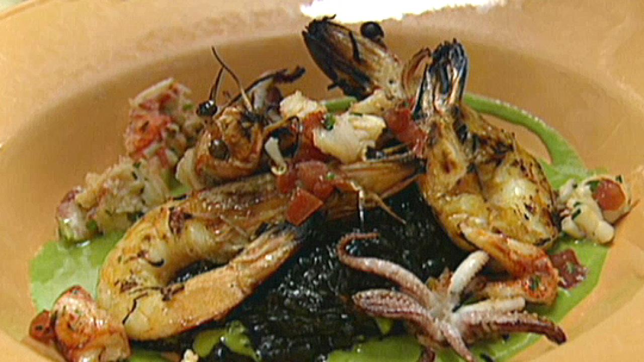 https://food.fnr.sndimg.com/content/dam/images/food/fullset/2010/4/5/0/0017967F3_Black-Squid-Ink-Risotto-with-Grilled-Prawns-Lobster-and-Green-Onion-Vinaigrette_s4x3.jpg.rend.hgtvcom.1280.720.suffix/1371591231469.jpeg