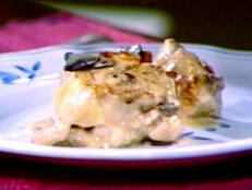 Chicken portions shallow-fried in butter and coated with a white wine sauce containing cepes and truffles