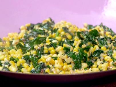 Garlicky creamed corn and spinach is served in a large bowl.