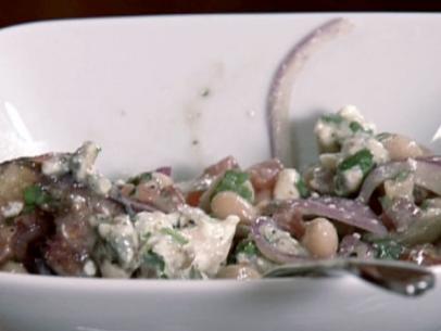 White bean salad with grilled figs, sliced red onion, diced pancetta, and blue cheese.