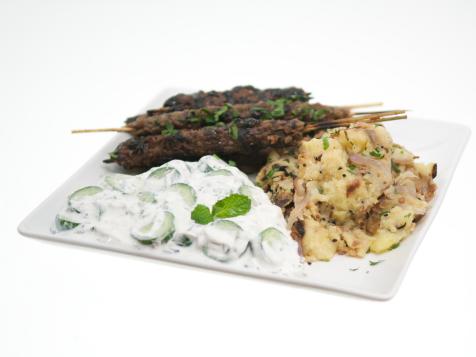 Ground Lamb Kofto Kebabs with Pomegranate Glaze, Bengali-Spiced Potatoes and Persian Cucumber Raita