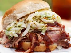 Make traditional barbecue pulled pork sandwiches at home using Pat and Gina Neely's step-by-step photos and top-rated recipe from Food Network Magazine.