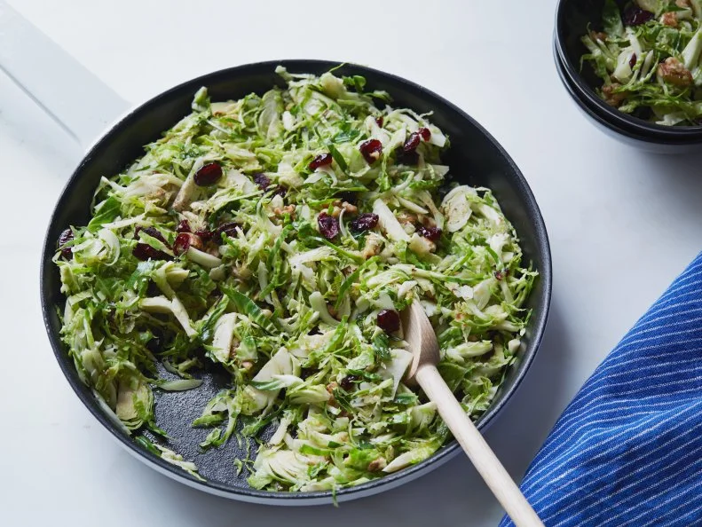 Cooking Channel 
Sunny Anderson Crunchy Sweet Brussels Sprout Salad
Thanksgiving Salad-Add Color & Greens to Your Table