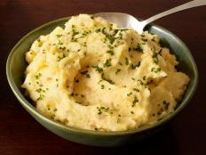 Add shredded smoked Gouda cheese and thinly sliced chives to Patrick and Gina Neely's recipe for The Best Mashed Potatoes from Food Network Magazine.