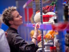 Rival-Chef Elizabeth Falkner looking through pantries in Episode 1 as seen on Food Network Next Iron Chef Season 4.