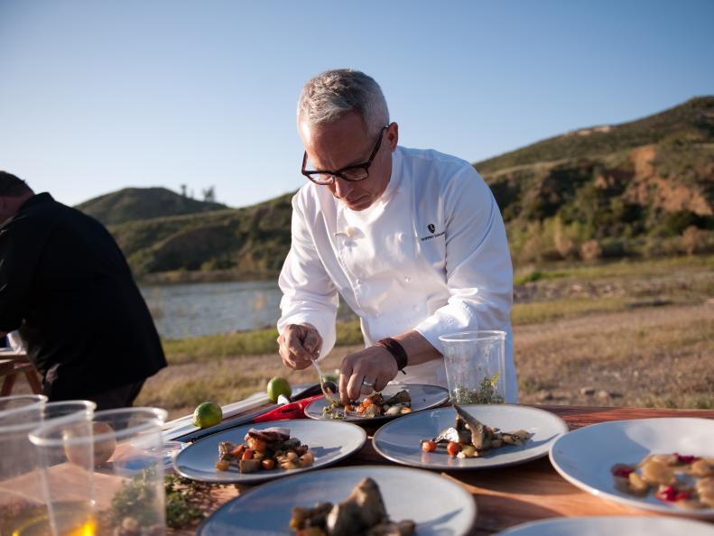 Rival-Chef Geoffrey Zakarian plating in Episode 1 Chairman's Challenge "Heat and Meat" as seen on Food Network Next Iron Chef Season 4.