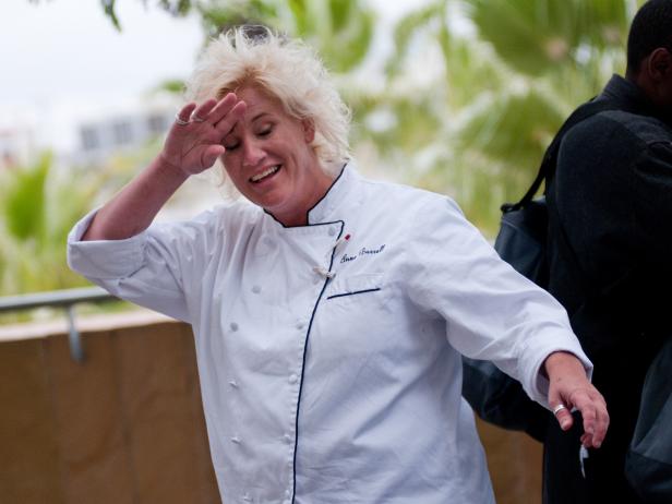 Rival-Chef Anne Burrell scrambling for ingredients at Petco Park for the Chairman's Challenge "Stadium Food" in Episode 2 as seen on Food Network Next Iron Chef Season 4.