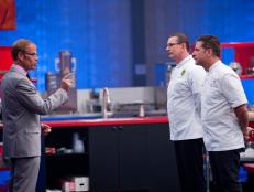 Host Alton Brown reavealing the Secret Ingredient "Peanut" Showdown to Rival-Chef Robert Irvine and Rival-Chef Michael Chiarello for their head-to-head battle in Episode 2 as seen on Food Network Next Iron Chef Season 4.