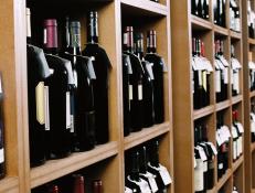 side view wine bottles kept on display in shelves