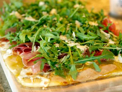 Ree Drummond - host, prepares Fig and Prosciutto Pizza with Arugula during episode 4 as seen on Food Network's Pioneer Woman Season 1. 