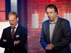 Host Alton Brown and Guest Host Kevin Nealon revealing the Chairman's Challenge "Improvisation" at the Hollywood Improv in Episode 4 as seen on Food Network Next Iron Chef Season 4.