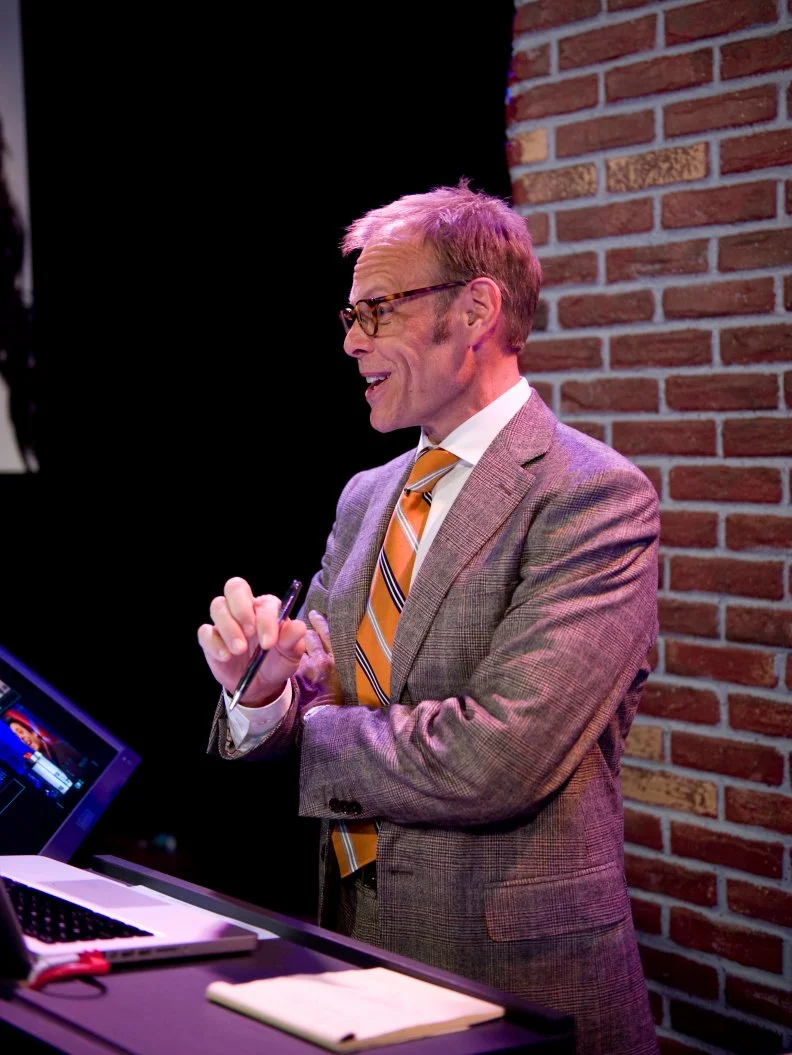 FNS7 Episode 10 Guest Host Alton Brown overseeing the Iron Chef Challenge.