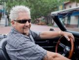 Host Guy Fieri driving his convertible down State Street in Santa Barbara, California, takes a cross-country road trip to visit some of America's classic "greasy spoon" restaurants - diners, drive-ins and dives - that have been doing it right for decades as seen on Food Network’s Diners, Drive-Ins, and Dives.