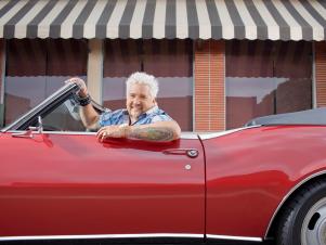 Guy Fieri 2011_guy Fieri Sitting In His Red Convertible_s4x3