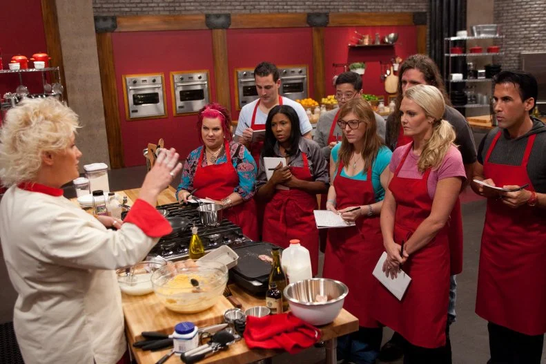 Worst Cooks In America Team Leader Chef Anne Burrell demonstrates how to make Pumpkin Orange Pancakes with Vanilla Whipped Cream and Cinnamon Maple Syrup and Thick Cut Bacon for the "Back to Basics Breakfast"  challenge as seen on Food Network's Worst Cooks in America, Season 3.
