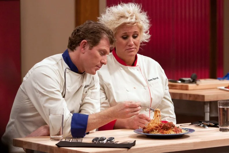 Worst Cooks In America Team Leaders Chef Bobby Flay and Chef Anne Burrell taste Recruit Vinnie Caligiuri's dish prepared for the "Show Us Your Stuff"  challenge as seen on Food Network's Worst Cooks in America, Season 3.
