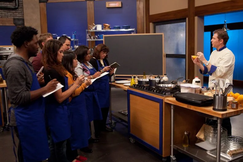Worst Cooks In America Team Leader Chef Bobby Flay demonstrates how to make Blue Corn Pancakes with Whipped Orange Honey Butter, Cinnamon Maple Syrup and Canadian Bacon to the Blue Team Recruits  for the "Back to Basics Breakfast"  challenge as seen on Food Network's Worst Cooks in America, Season 3.