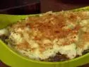 Meatless shepherd's pie made with mushrooms, carrots, garlic, kale, onions, rosemary, and potatoes on top