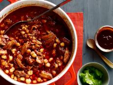 Food Network Kitchen's 5-star posole (pozole) recipe is made by stewing pork until pull-apart tender with chiles and hominy. Rehydrated dried chiles give the stew a deep red hue and a depth of flavor.
