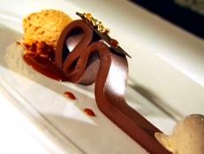 Known for its dazzling plates with a playful edge, Tru's dishes are practically works of art. But they're also delicious, as Cat Cora shared on The Best Thing I Ever Ate. The Chocolate Bar dessert with its chocolate ganache ribbon is one of the most decadent desserts she&rsquo;s ever had.