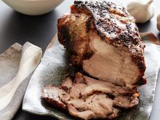 A basic garlic and olive oil mixture is the flavor basis for Aaron McCargo Jr.'s Simple Roasted Pork Shoulder recipe from Big Daddy's House on Food Network.