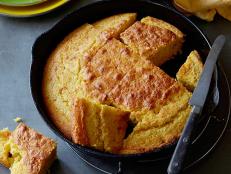 Bake Alton Brown's perfect Creamed Corn Cornbread recipe from Good Eats on Food Network in a cast-iron skillet using cornmeal, buttermilk and creamed corn.