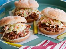 Tyler Florence's Pulled Pork Barbecue recipe from Food Network starts with a flavorful dry rub that includes paprika, brown sugar and mustard powder.