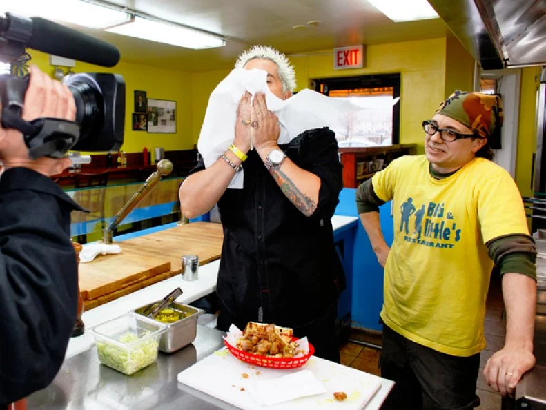 Food Network star  Guy Fieri films his show Diners, Drive Ins and Dives at two resturants in Chicago. Big & Little resturant.