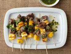 Go beyond corn dogs and shish kabobs with Giada’s best summer recipes on skewers.