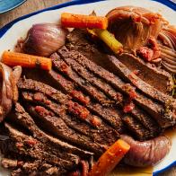 Description: Tyler Florence's Beef Brisket. Keywords: Garlic, Rosemary, Beef Brisket, Carrots, Celery, Red Onions, Dry Red Wine, Russet Potatoes, Onions, Eggs, Chives.