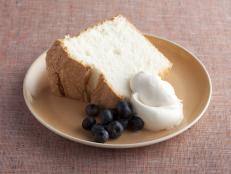 Bake Alton Brown's light, airy Angel Food Cake from Good Eats on Food Network, then serve the prepared cake with whipped cream and berries.