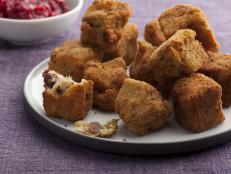 Transform Thanksgiving leftovers into Sunny Anderson's recipe for stuffing balls: Second Day Fried Stuffing Bites with Cranberry Sauce Pesto from Food Network.