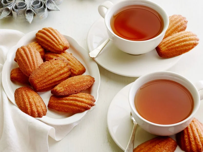 BROWN BUTTER MADELEINESMelissa dâ  ArabianTen Dollar Dinners/Clay Pot CookingFood NetworkUnsalted Butter, Eggs, Sugar, Honey, Flour, Baking Powder, Salt, Orange