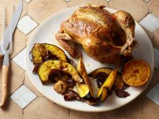 This ain't no wimpy white wine chicken dish! The heady roasted garlic, citrusy orange, and herbal tarragon add enough flavor muscle to this bird to make it a suitable partner for a bottle of red.
