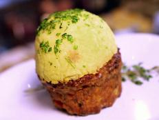 Use an ice cream scoop to get the perfect serving of mashed potatoes to put on top of your meatloaf in this recipe from Food Network.