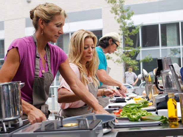 (L-R) Contestants Summer Sanders, Taylor Dayne and Lou Diamond Phillips from Host Rachael Ray's team start working on their dishes for the Lunch Carts challenge as seen on Episode 4 of Food Network's Rachael Vs. Guy Season 1