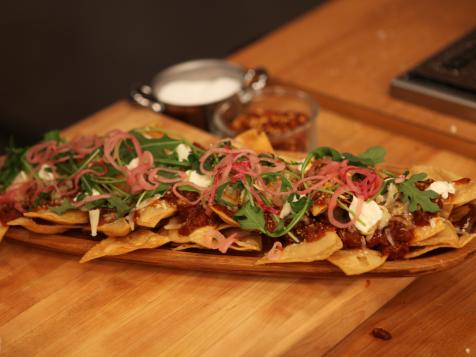 Sweet and Spicy Sausage Ragu Nachos with Pickled Onions