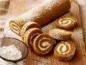 PUMPKIN ROLLTrisha YearwoodTrishaâ  s Southern Kitchen/Trishaâ  s Tricks and TreatsFood NetworkEggs, Granulated Sugar, Canned Pumpkin, Lemon Juice, AllpurposeFlour, Ground Ginger,Salt, Baking Powder, Ground Cinnamon, Pecans, Confectionersâ   Sugar, Cream Cheese, Butter,Vanilla Extract