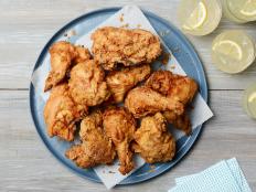 A quick dredge of buttermilk and seasoned flour is the secret to this perfectly moist, crunchy Fried Chicken recipe.
