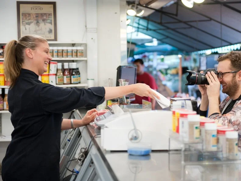 Rival Chef Amanda Freitag hugs fellow safe Rival Chef Elizabeth Falkner after the  for the  "White Bread" as seen on Food Network's Season 5.