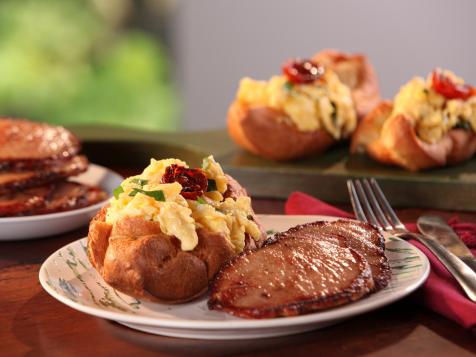 Black Pepper Popovers filled with Vermont Cheddar and Herb Scrambled Eggs and Maple-Mustard Glazed Canadian Bacon