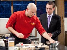 Host Ted Allen checks in with Chef Sean Scotese, as seen on Food Network’s Chopped Champions, Season 14.
