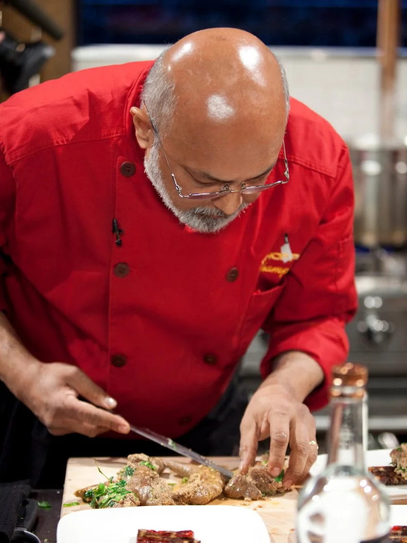 Chef Walter D'Rozario plates his food, as seen on Food Network’s Chopped Champions, Season 14.
