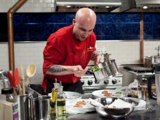 Chopped Champion Chef Vinson Petrillo working on his entree that must include: Abalone, curry leaves, amaranth grain, Serrano Ham, as seen on Food Networks Chopped, Season 14.