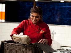 Chef Fatima Ali opens her basket, as seen on Food Network’s Chopped Champions, Season 14.
